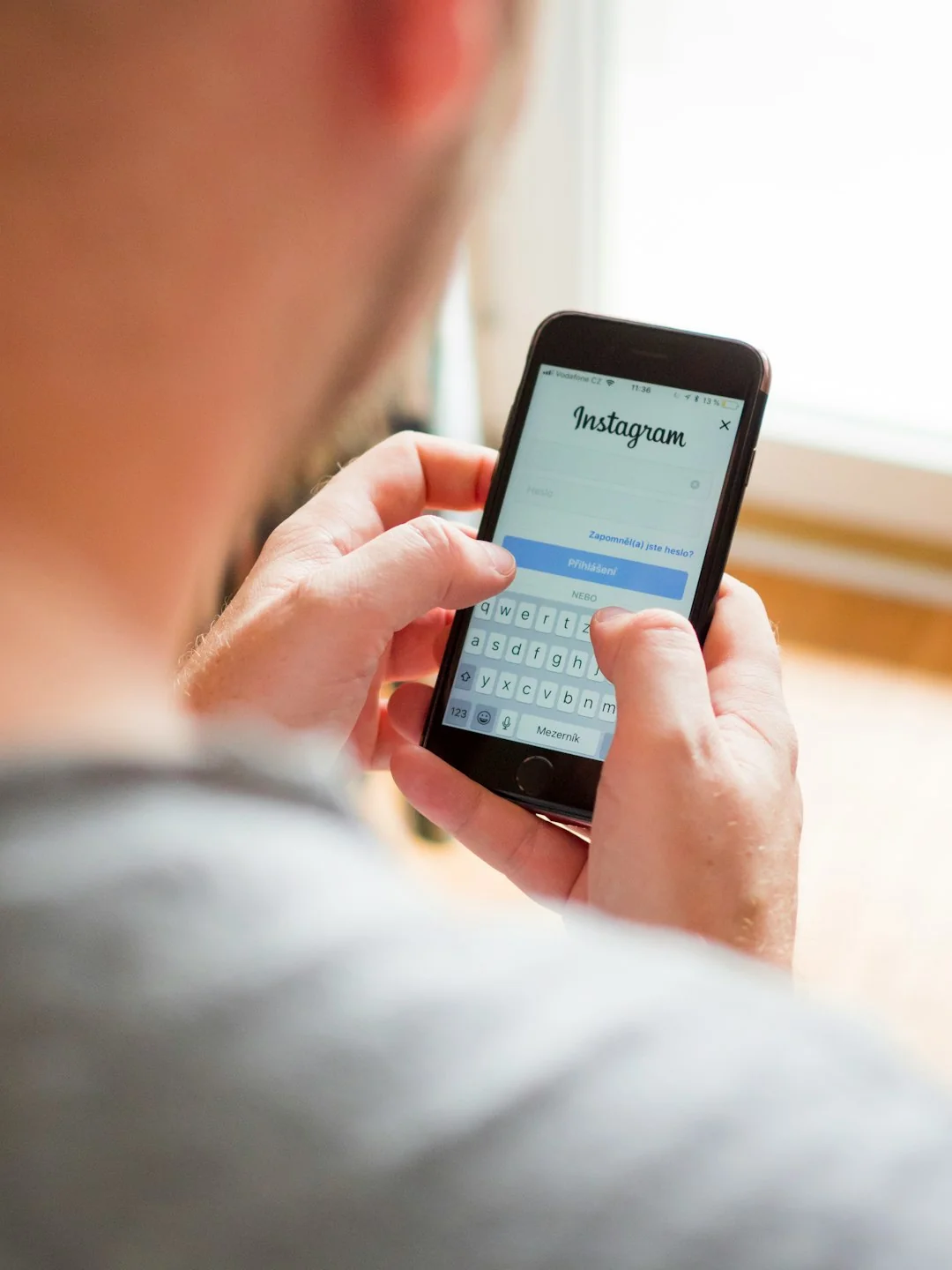 about-01 A person is using their smartphone to browse the SumUp Instagram profile, focusing on posts related to marketing strategies and business tips. In the background, a laptop displays a webpage about tools for business growth, suggesting a workspace or content creation environment. This image highlights the use of social media for brand promotion, digital marketing, and business engagement, making it relevant for content creators, marketers, and entrepreneurs.